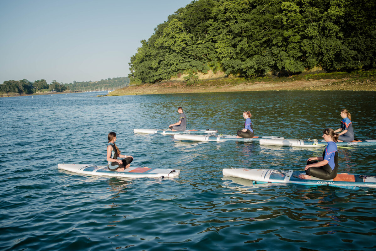 Paddle Yoga Faumea Options de team-building en paddle-yoga pour groupes.